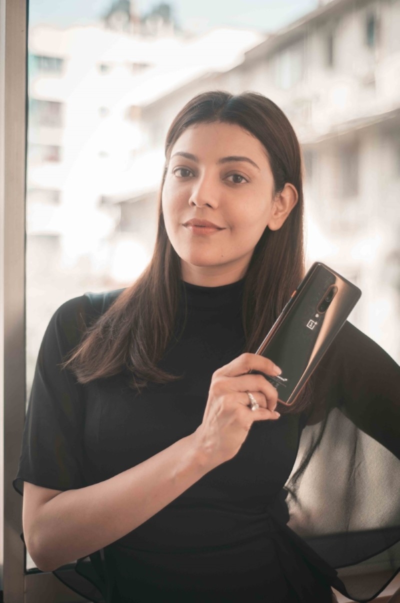 Kajol Aggarwal in black posing for OnePlus 7T Pro Mclaren edition influencer campaign